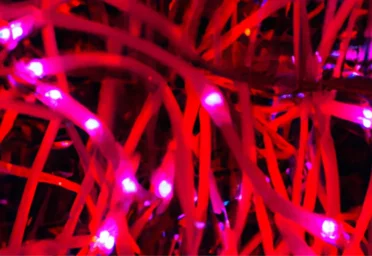 DALL_E_2023-06-29_10.46.21_-_beaufiful_displays_of_red_lights_shapes_hyper_realistic-752550